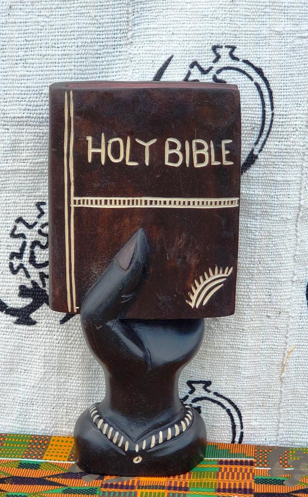 Hand Holding Holy Bible